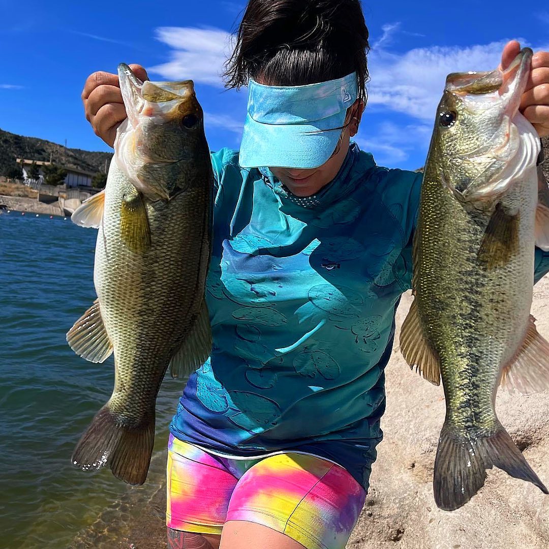 Female Angler holding Fat Bass